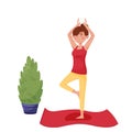 Lettering let`s stay home. A girl in a red shirt and sweatpants on a mat does yoga near a home plant and a window with curtains. Royalty Free Stock Photo
